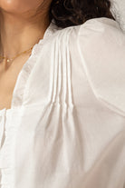 White ruffle trim blouse_6