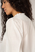 White ruffle trim blouse_11